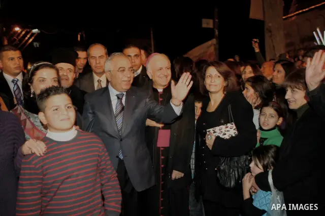 Palestinian Prime Minister Salam Fayyad attends the Christmas tree lighting celebration in the West Bank town of Beit Shour, near Bethlehem, on Dec. 17, 2011. Photo by Mustafa Abu Dayeh