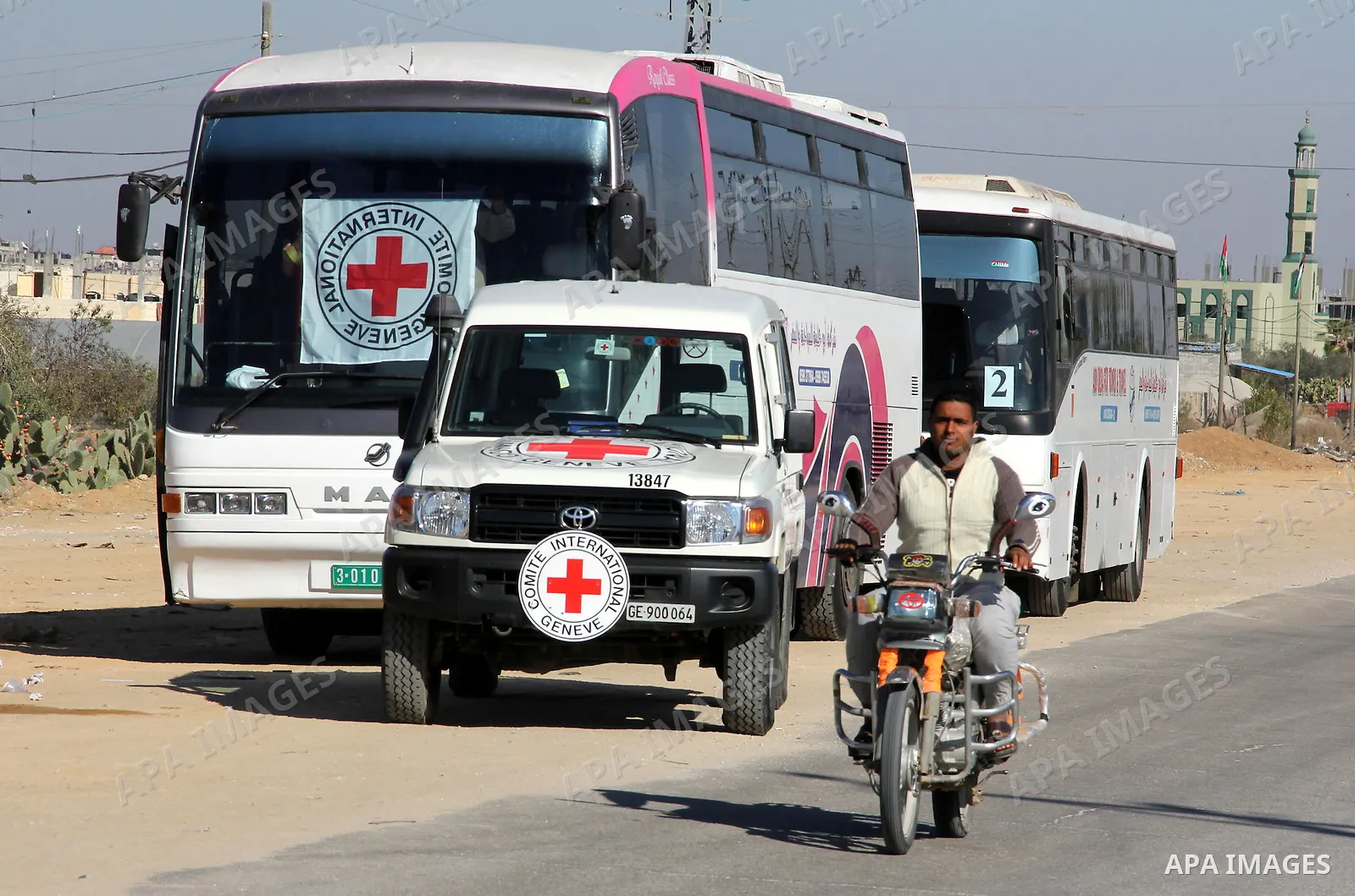 Red Cross vehicles arrive in Rafah border crossing, in southern Gaza Strip, on Dec. 18, 2011. About 40 live in Gaza Strip from the total 550 Palestinian prisoners will be freed on Sunday from Israeli jails, in the second...