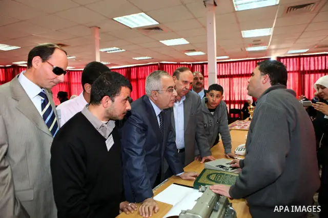 Palestinian Prime Minister Salam Fayyad visits the exhibition organized by Noor Al Ain "the light of eye" Association for the blind and visually impaired in the West Bank city of Ramallah on Dec. 18, 2011. Photo by Musta...