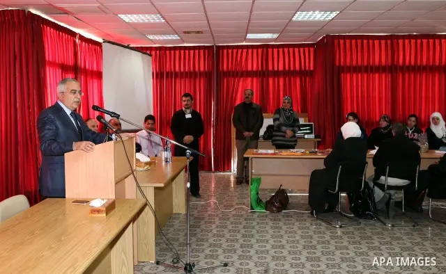Palestinian Prime Minister Salam Fayyad visits the exhibition organized by Noor Al Ain "the light of eye" Association for the blind and visually impaired in the West Bank city of Ramallah on Dec. 18, 2011. Photo by Musta...