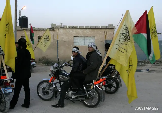 Relatives of Palestinian prisoners wait at Rafah crossing before their release from Israeli jails December 18, 2011. Israel plans to release 550 Palestinian prisoners on Sunday in the second stage of a deal with Hamas th...