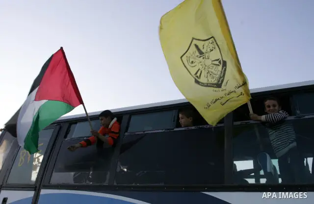 Relatives of Palestinian prisoners wait at Rafah crossing before their release from Israeli jails December 18, 2011. Israel plans to release 550 Palestinian prisoners on Sunday in the second stage of a deal with Hamas th...