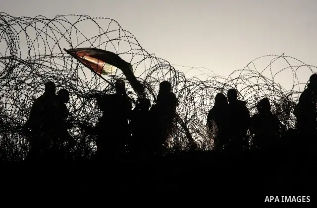Relatives of Palestinian prisoners wait outside Ofer prison, near the West Bank city of Ramallah December 18, 2011. Clashes erupted while Palestinians gathered to wait for the release of Palestinian prisoners. Israel pla...