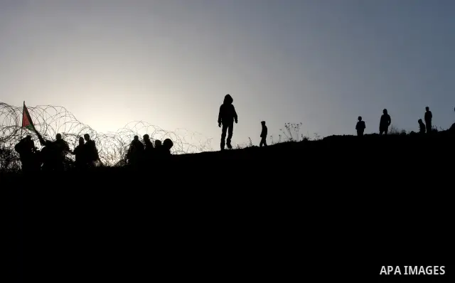 Relatives of Palestinian prisoners wait outside Ofer prison, near the West Bank city of Ramallah December 18, 2011. Clashes erupted while Palestinians gathered to wait for the release of Palestinian prisoners. Israel pla...