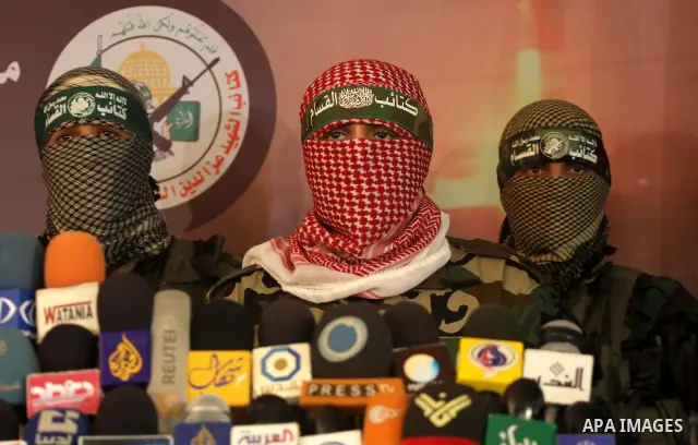 The spokesman of Ezzedine al-Qassam Brigade, the military wing of the Palestinian Islamist movement Hamas which rules Gaza, Abo Obeda gives a press conference in Gaza City on Dec. 18, 2011, as Israel plans to release 550...