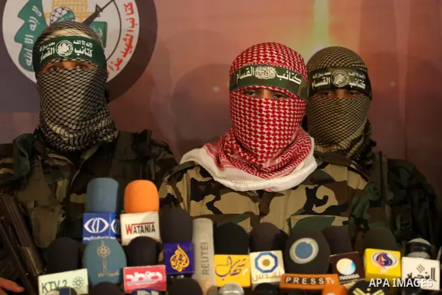 The spokesman of Ezzedine al-Qassam Brigade, the military wing of the Palestinian Islamist movement Hamas which rules Gaza, Abo Obeda gives a press conference in Gaza City on Dec. 18, 2011, as Israel plans to release 550...