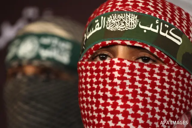 The spokesman of Ezzedine al-Qassam Brigade, the military wing of the Palestinian Islamist movement Hamas which rules Gaza, Abo Obeda gives a press conference in Gaza City on Dec. 18, 2011, as Israel plans to release 550...