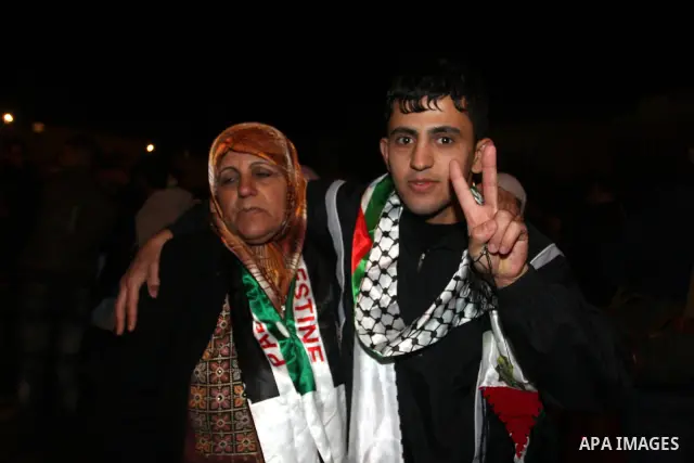 A Palestinian prisoner is welcomed after being released on December 18, 2011, at the headquarters of President Mahmud Abbas in Ramallah. Israel released 550 Palestinian prisoners to complete a swap deal which brought abo...