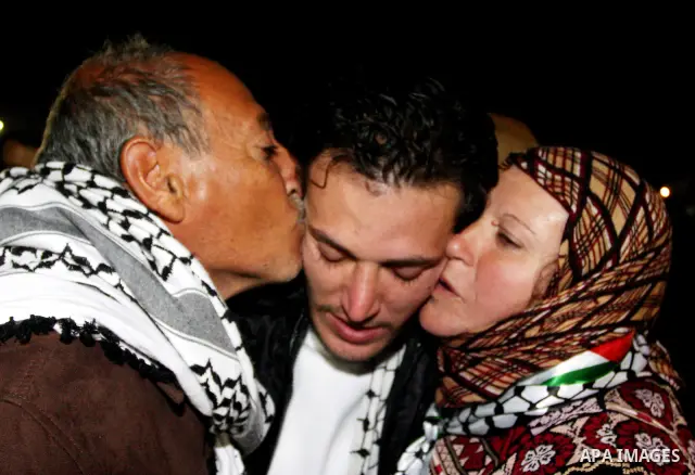 A Palestinian prisoner is welcomed after being released on December 18, 2011, at the headquarters of President Mahmud Abbas in Ramallah. Israel released 550 Palestinian prisoners to complete a swap deal which brought abo...
