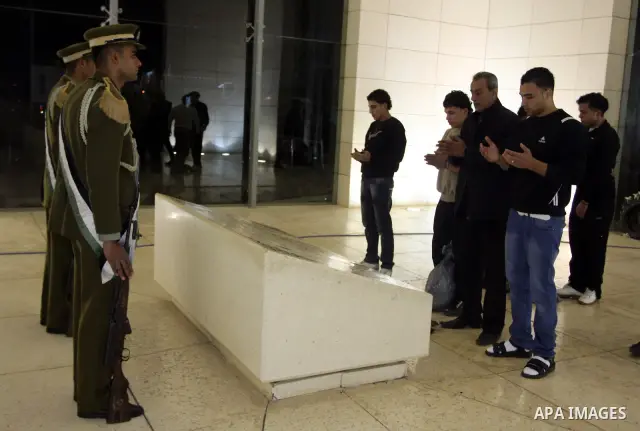 Released Palestinian prisoners celebrate as they arrive to the West Bank city of Ramallah, early Monday, Dec. 19, 2011. Israel released hundreds of Palestinian prisoners late Sunday, the second and final phase of a swap...
