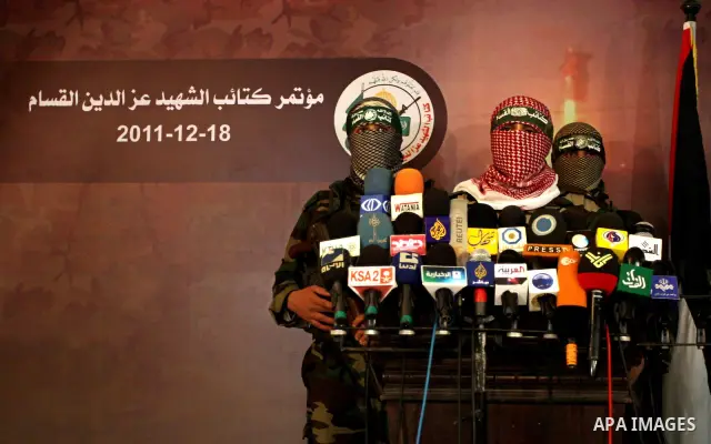 The spokesman of Ezzedine al-Qassam Brigade, the military wing of the Palestinian Islamist movement Hamas which rules Gaza, Abo Obeda gives a press conference in Gaza City on Dec. 18, 2011, as Israel plans to release 550...