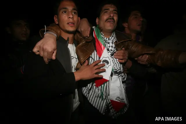 A Palestinian prisoner hugs his relatives as he arrives in Rafah, crossing in southern Gaza strip, after being released on December 18, 2011. Israel today freed 550 Palestinian prisoners, completing the second phase of a...