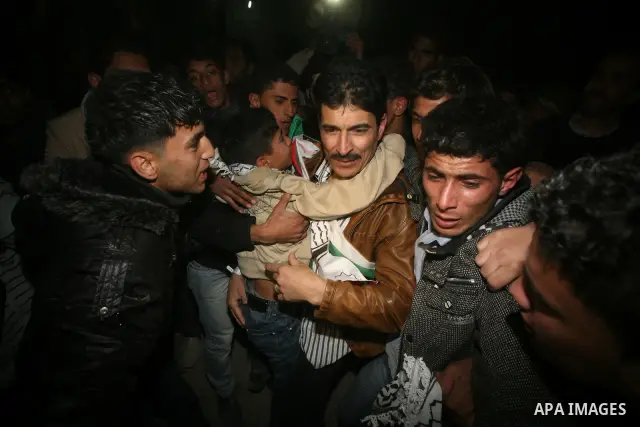 A Palestinian prisoner hugs his relatives as he arrives in Rafah, crossing in southern Gaza strip, after being released on December 18, 2011. Israel today freed 550 Palestinian prisoners, completing the second phase of a...