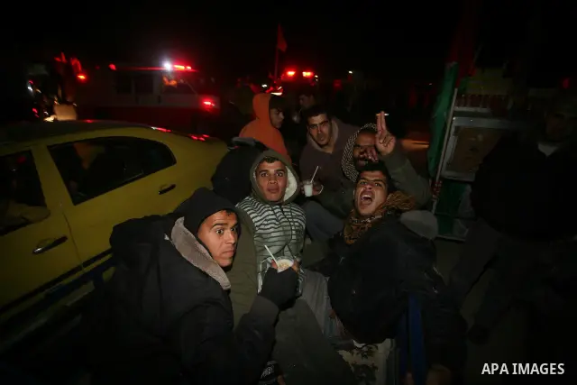 A Palestinian prisoner hugs his relatives as he arrives in Rafah, crossing in southern Gaza strip, after being released on December 18, 2011. Israel today freed 550 Palestinian prisoners, completing the second phase of a...