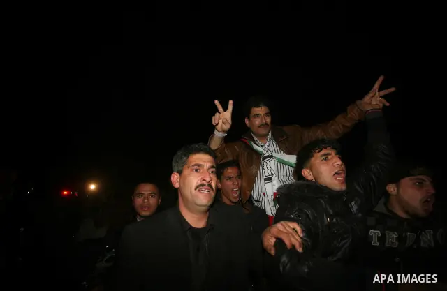 A Palestinian prisoner hugs his relatives as he arrives in Rafah, crossing in southern Gaza strip, after being released on December 18, 2011. Israel today freed 550 Palestinian prisoners, completing the second phase of a...