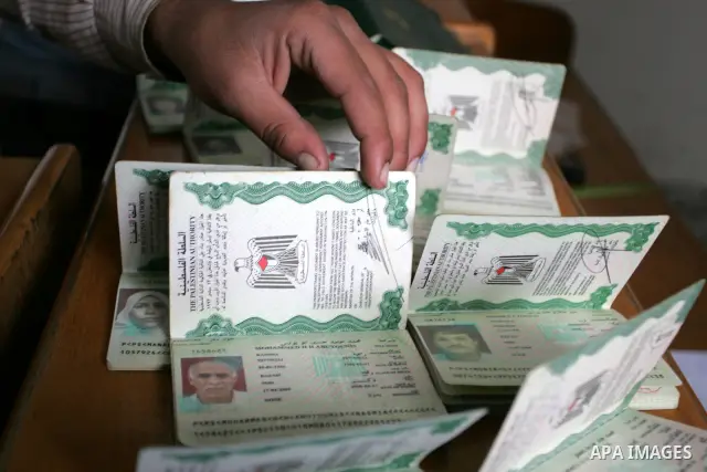 Palestinian employees working in a the Ministry of the Interior Department of Passports and visas for travel in Rafah, southern Gaza Strip December 21, 2011. Hamas spokesman Fawzi Barhoum,said that " he discussed the pro...