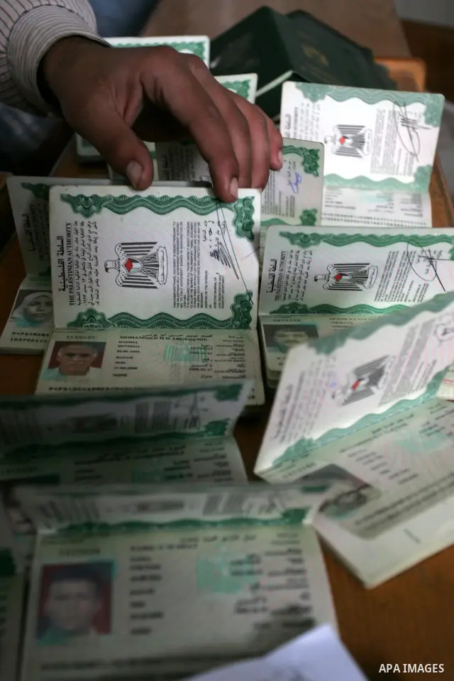 Palestinian employees working in a the Ministry of the Interior Department of Passports and visas for travel in Rafah, southern Gaza Strip December 21, 2011. Hamas spokesman Fawzi Barhoum,said that " he discussed the pro...