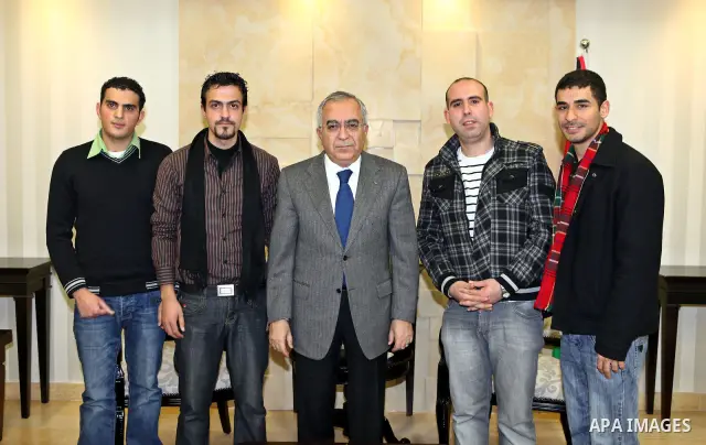 Palestinian Prime Minister Salam Fayyad, receives the winners of the first rank in the Google award competition for Marketing, in the West Bank city of Ramallah, on Dec. 21, 2011. Photo by Mustafa Abu Dayeh