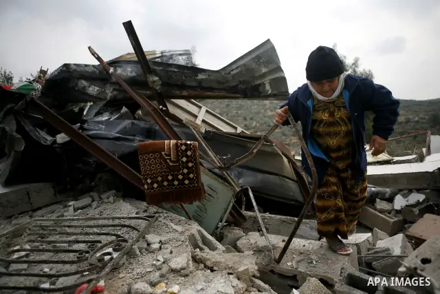 Palestinians inspect a house which was demolished by Israeli army in the occupied West Bank city of Nablus on December 21, 2011. Photo by Wagdi Eshtayah.