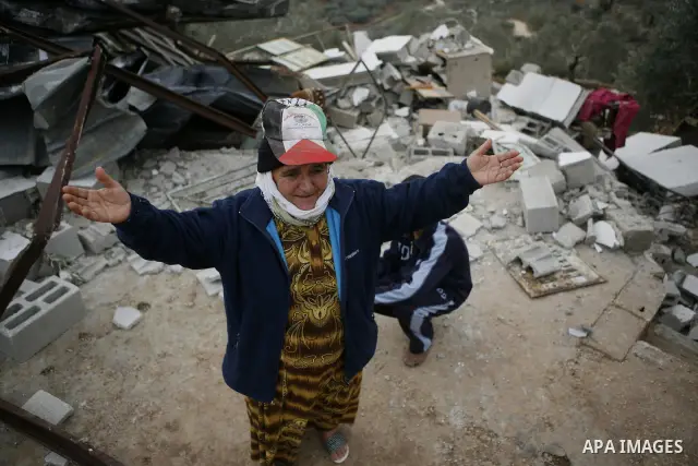 Palestinians inspect a house which was demolished by Israeli army in the occupied West Bank city of Nablus on December 21, 2011. Photo by Wagdi Eshtayah.