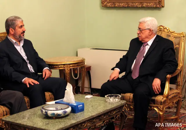 Palestinian President, Mahmoud Abbas (Abu Mazen) meets with the exiled leader of the Palestinian Islamist movement Hamas, Khaled Meshaal, in Cairo on December 21, 2011. Palestinian factions, led by the former rivals Hama...