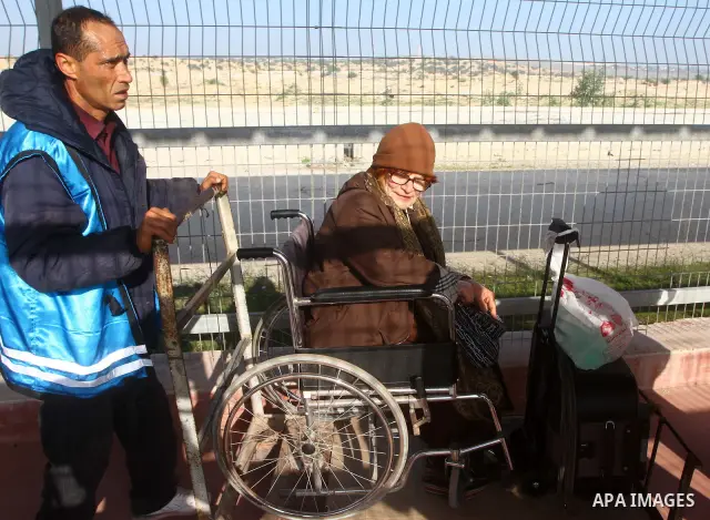 A Christian Palestinian family leaves Gaza to enter Israel through the Erez border crossing between Israel and northern Gaza Strip on Dec. 22,2011. The Israeli army on Thursday allowed some 550 Christian Palestinians to...