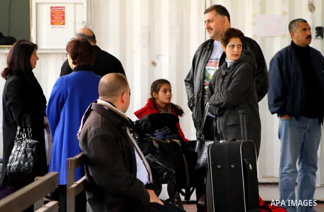 A Christian Palestinian family leaves Gaza to enter Israel through the Erez border crossing between Israel and northern Gaza Strip on Dec. 22,2011. The Israeli army on Thursday allowed some 550 Christian Palestinians to...