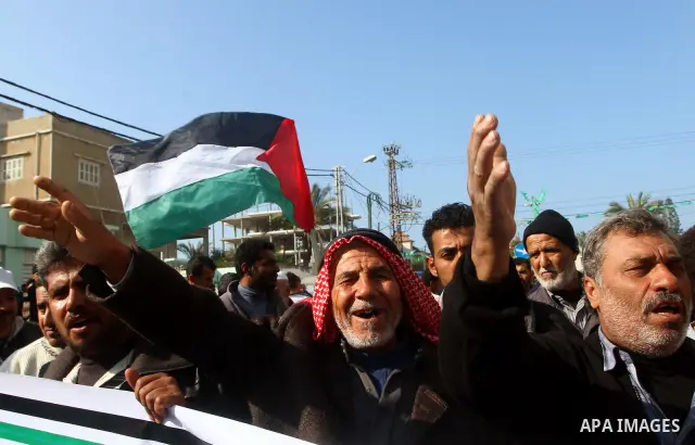 Palestinian fishermen take part in a protest in front of the Red Cross a protest against the Israel army assaults on fishermen in Gaza City, on Dec. 22. 2011. Photo by Ashraf Amra
