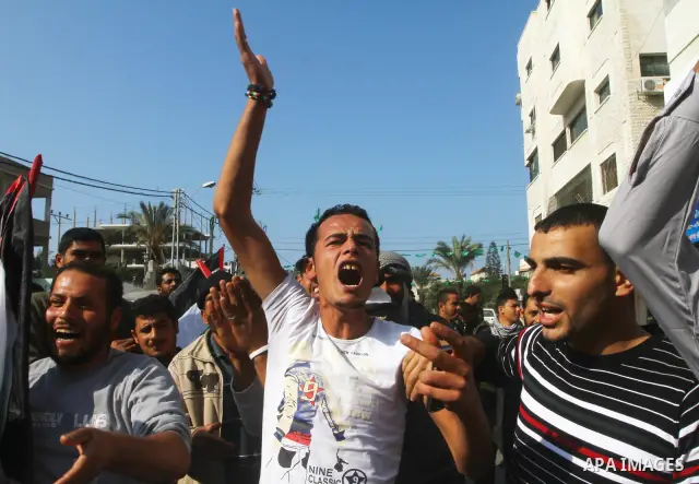 Palestinian fishermen take part in a protest in front of the Red Cross a protest against the Israel army assaults on fishermen in Gaza City, on Dec. 22. 2011. Photo by Ashraf Amra