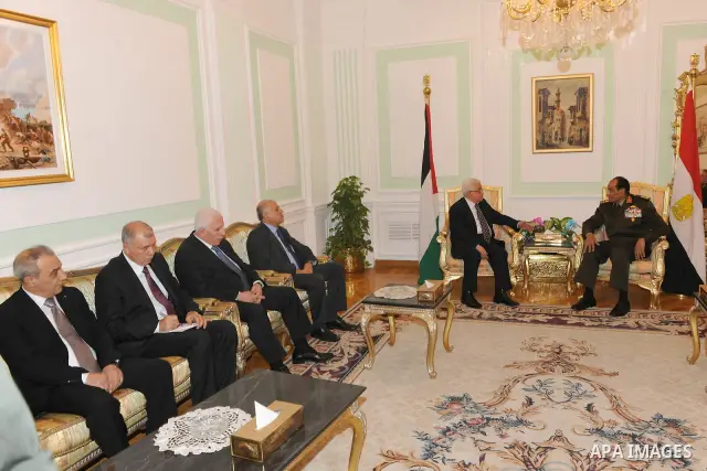 Field Marshal Mohamed Hussein Tantawi, the head of Egypt's ruling Supreme Council of the Armed Forces (SCAF), meets Palestinian President Mahmoud Abbas (L) at the Defence Ministry in Cairo December. 22, 2011. Photo by Th...