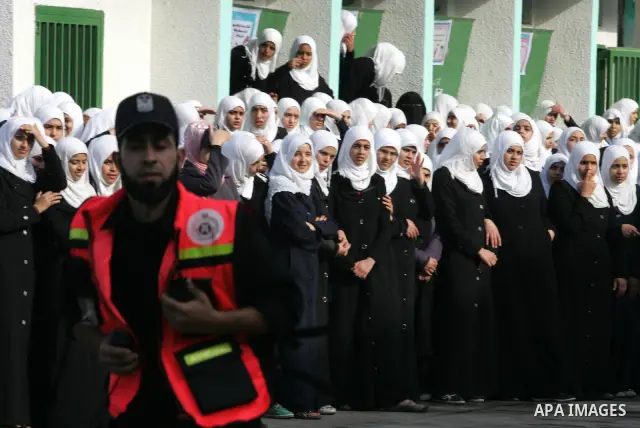 Palestinian schoolgirls take part in a civil defence exercises at a school in Rafah, in the southern of Gaza Strip on December 22, 2011. Photo by Abed Rahim Khatib