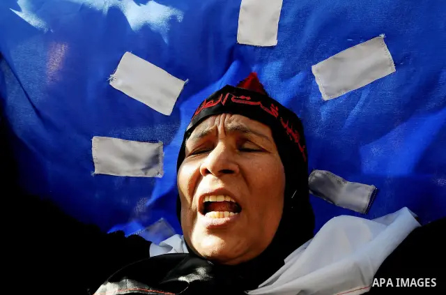 Egyptian protesters shout anti-military ruling council slogans during a protest at Tahrir Square, Cairo, Egypt Friday, Dec. 23, 2011. Several thousand Egyptians rallied in Cairo's central Tahrir Square Friday to denounce...