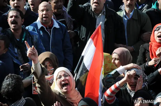 Egyptian protesters shout anti-military ruling council slogans during a protest at Tahrir Square, Cairo, Egypt Friday, Dec. 23, 2011. Several thousand Egyptians rallied in Cairo's central Tahrir Square Friday to denounce...