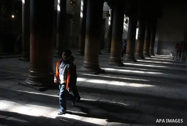 Christian pilgrims visit the Church of the Nativity in the biblical West Bank city of Bethlehem on 23 December 2011 as Christian pilgrims start gathering in the church belived to be the birthplace of Jesus Christ to cele...