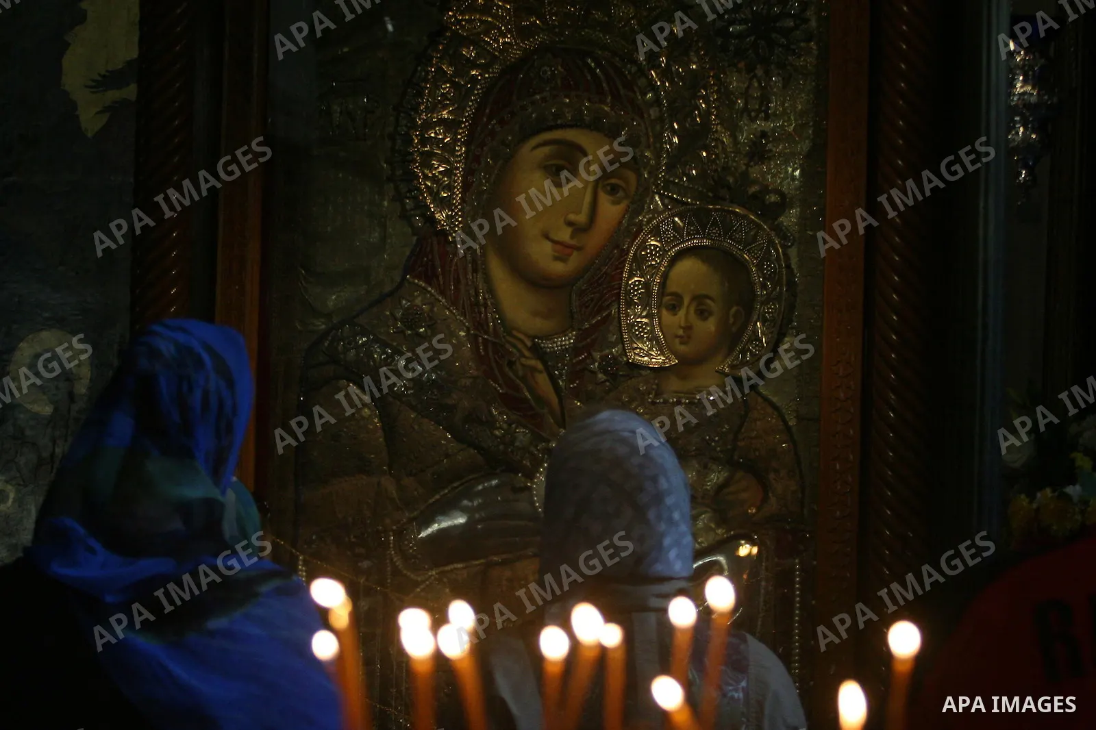 Christian pilgrims pray in the Church of the Nativity in the biblical West Bank city of Bethlehem on December 23, 2011, as Christian pilgrims started gathering in the traditional birthplace of Jesus Christ to attend the...