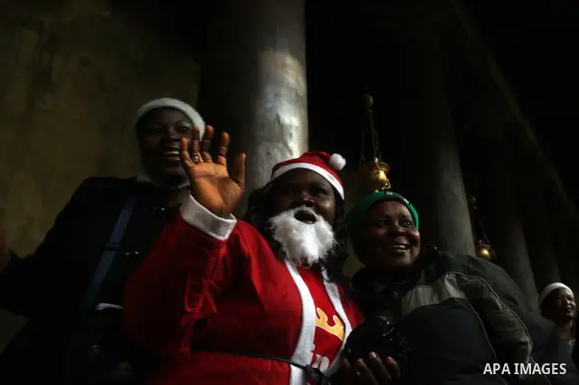 Christian pilgrims visit the Church of the Nativity in the biblical West Bank city of Bethlehem on Christmas Eve on 24 December 2011. Photo by Issam Rimawi