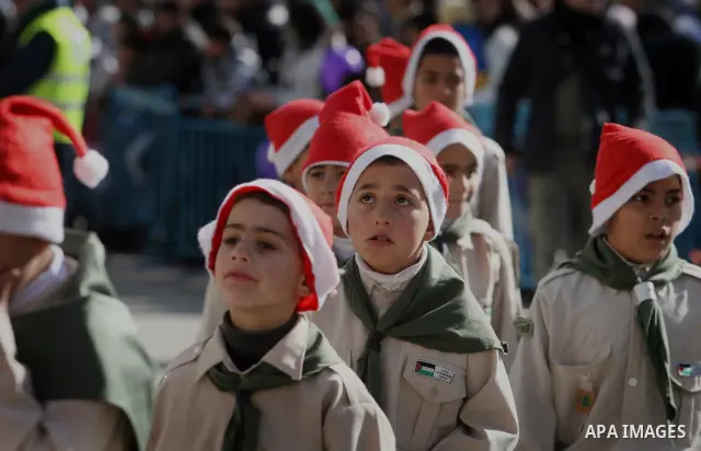 Christian pilgrims visit the Church of the Nativity in the biblical West Bank city of Bethlehem on Christmas Eve on 24 December 2011, as thousands of Christian pilgrims descended on the holy city to celebrate in Jesus' t...