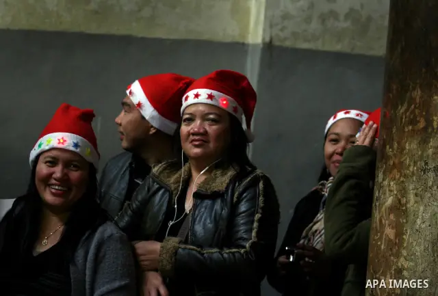 Christian pilgrims visit the Church of the Nativity in the biblical West Bank city of Bethlehem on Christmas Eve on 24 December 2011. Photo by Issam Rimawi