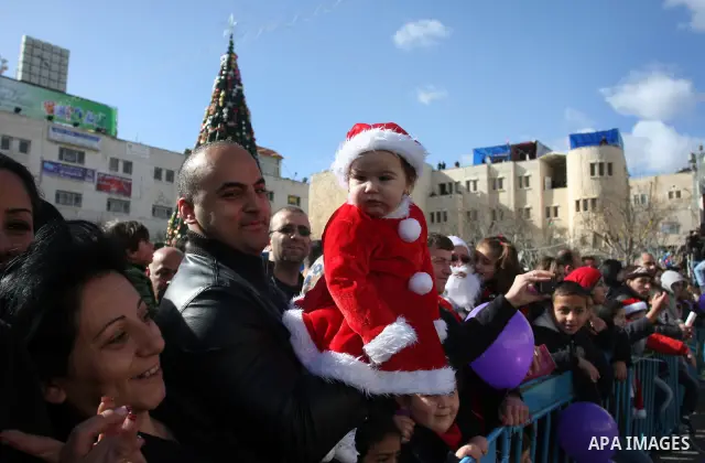 Christian pilgrims visit the Church of the Nativity in the biblical West Bank city of Bethlehem on Christmas Eve on 24 December 2011, as thousands of Christian pilgrims descended on the holy city to celebrate in Jesus' t...