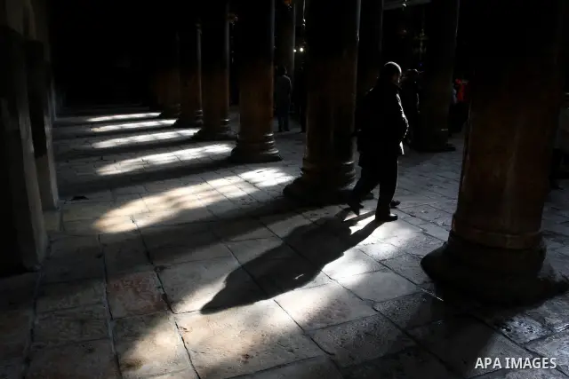 Christian pilgrims visit the Church of the Nativity in the biblical West Bank city of Bethlehem on Christmas Eve on 24 December 2011. Photo by Issam Rimawi
