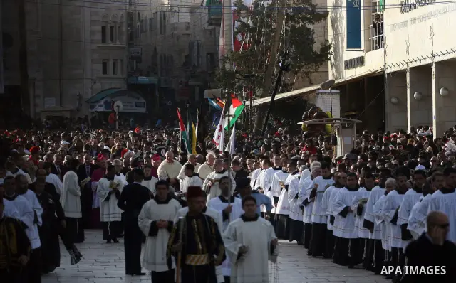 Christian pilgrims visit the Church of the Nativity in the biblical West Bank city of Bethlehem on Christmas Eve on 24 December 2011, as thousands of Christian pilgrims descended on the holy city to celebrate in Jesus' t...