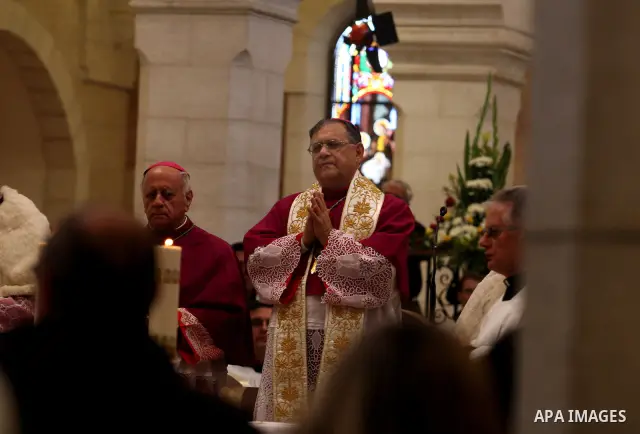 The Latin Patriarch of Jerusalem Fouad Twal waves upon his arrival to the Church of the Nativity to attend Christmas celebrations in West Bank town of Bethlehem December 24, 2011. Photo by Issam Rimawi