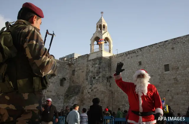 Christian pilgrims visit the Church of the Nativity in the biblical West Bank city of Bethlehem on Christmas Eve on 24 December 2011, as thousands of Christian pilgrims descended on the holy city to celebrate in Jesus' t...