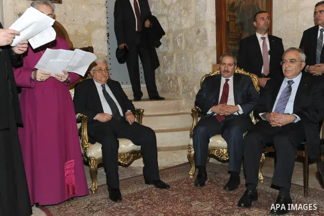 Palestinian President, Mahmoud Abbas (Abu Mazen) participante Mass held by the private community in the Church of St. Alangalkanh Grace in the west bank city of Bethlehem, on Dec. 24, 2011. Photo by Thaer Ganaim