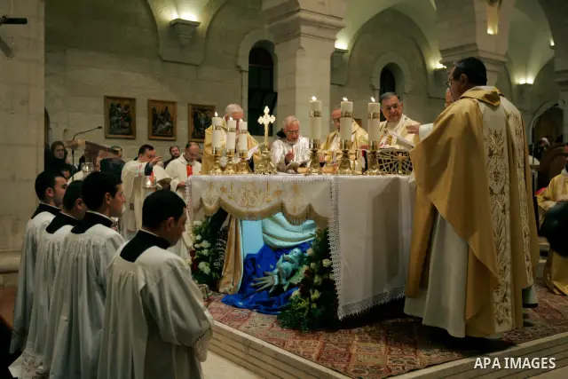 Christian priests hold the Christmas midnight Mass at the Church of the Nativity, traditionally believed to be the birthplace of Jesus Christ, in the West Bank town of Bethlehem early Sunday, Dec. 25, 2011. (APAimages Ph...