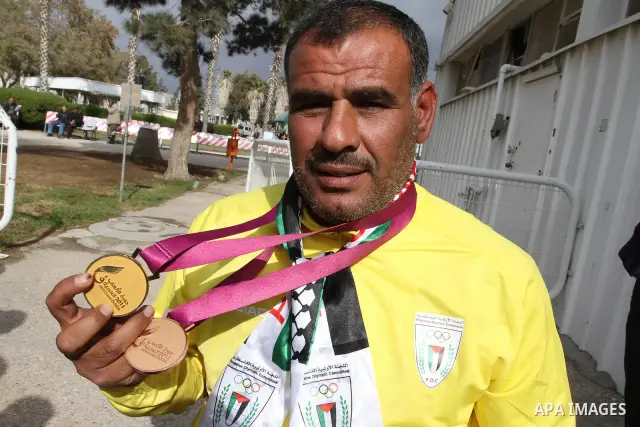 Palestinian members of the Paralympic Games for the disabled participate in training at Al-Gezira Club in Gaza city on Dec. 25, 2011. Palestinian Paralympic Games won Arab and international medals and have achieved excel...