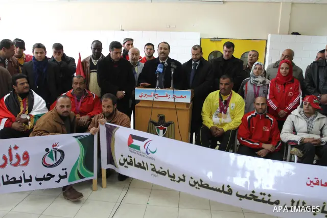 Palestinian members of the Paralympic Games for the disabled participate in training at Al-Gezira Club in Gaza city on Dec. 25, 2011. Palestinian Paralympic Games won Arab and international medals and have achieved excel...