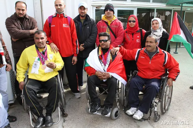 Palestinian members of the Paralympic Games for the disabled participate in training at Al-Gezira Club in Gaza city on Dec. 25, 2011. Palestinian Paralympic Games won Arab and international medals and have achieved excel...