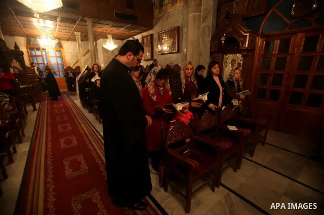 Palestinian Christians pray on Christmas day in the Saint Porfirios church in Gaza City December 25, 2011. Photo by Ashraf Amra