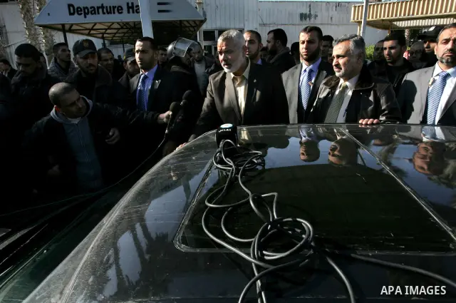 Palestinian Prime Minister in Gaza Strip, Ismail Haniya, arrived to the Rafah border crossing in the southern Gaza Strip on Dec 25, 2011. Haniya will go in foreign tour to participate in an international conference for J...